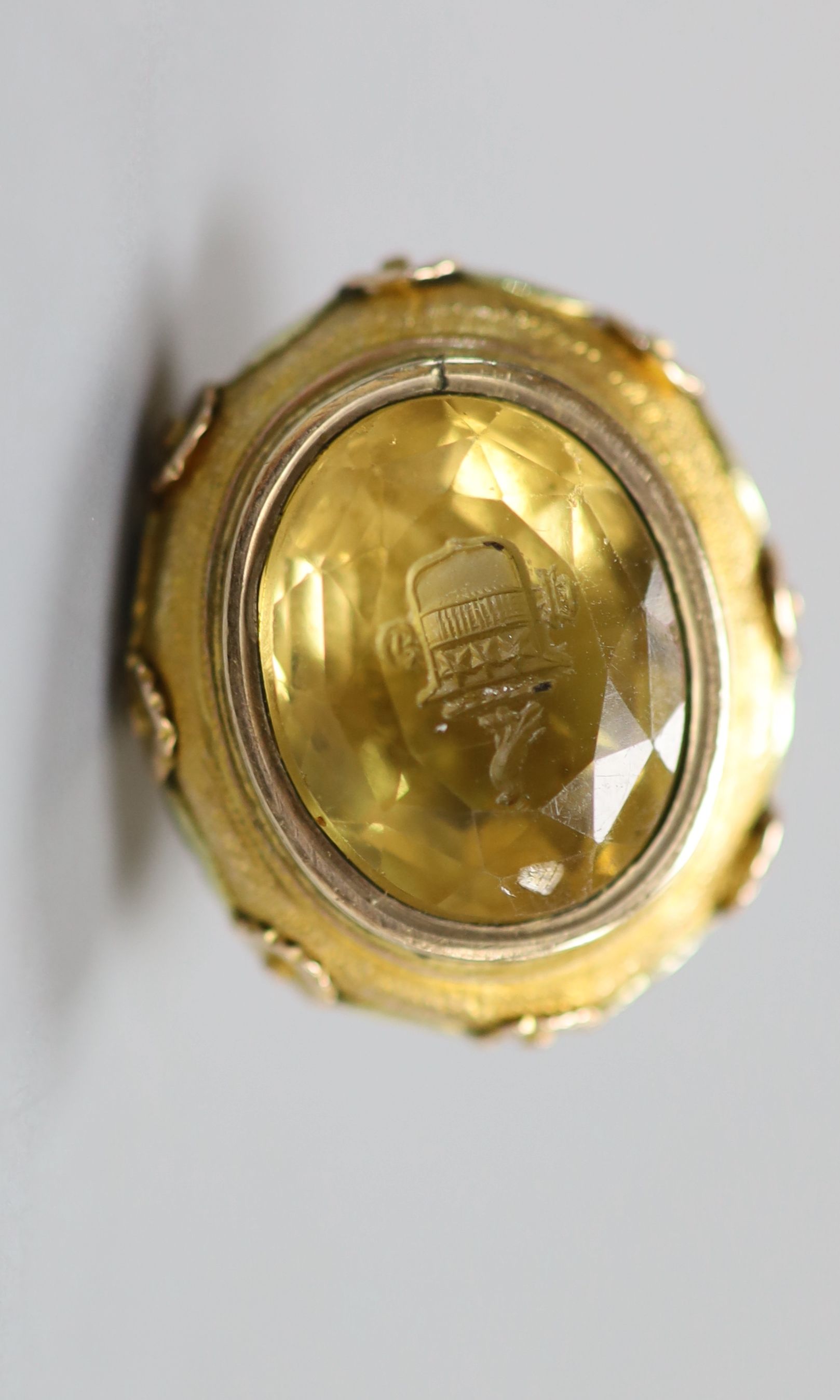 A 19th century three colour yellow metal and citrine set fob seal, the matrix carved with crest
